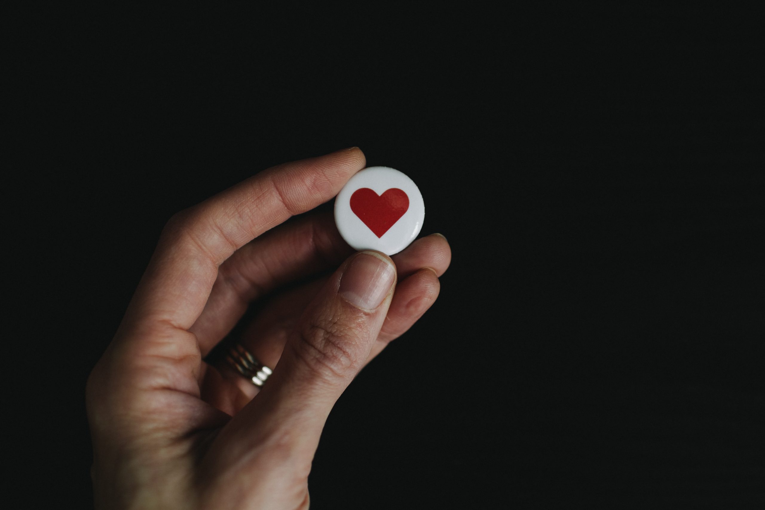 hand holding a heart icon